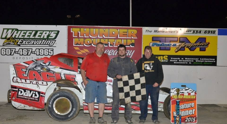 Adam Hilton celebrating a 2015 feature win at Thunder Mountain Speedway